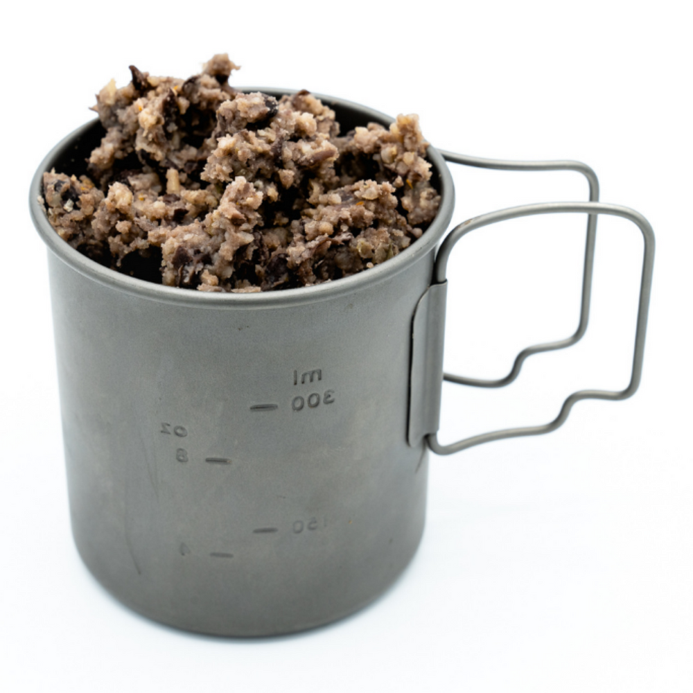 
                  
                    Photo of Alt Route Meals Black Beans and Rice dinner rehydrated and in a titanium cup against a white stock background.
                  
                